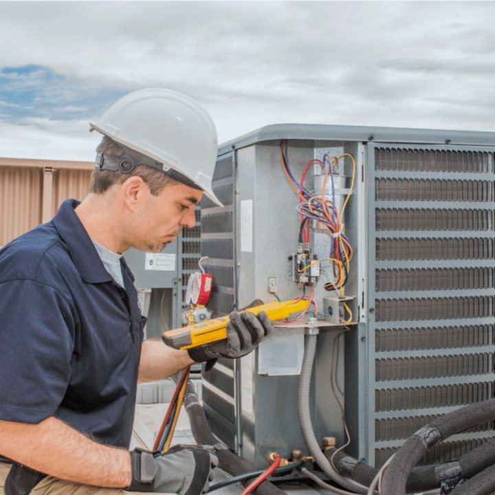 Forest Heating & Cooling HVAC technician on a service call in Forest, Ontario